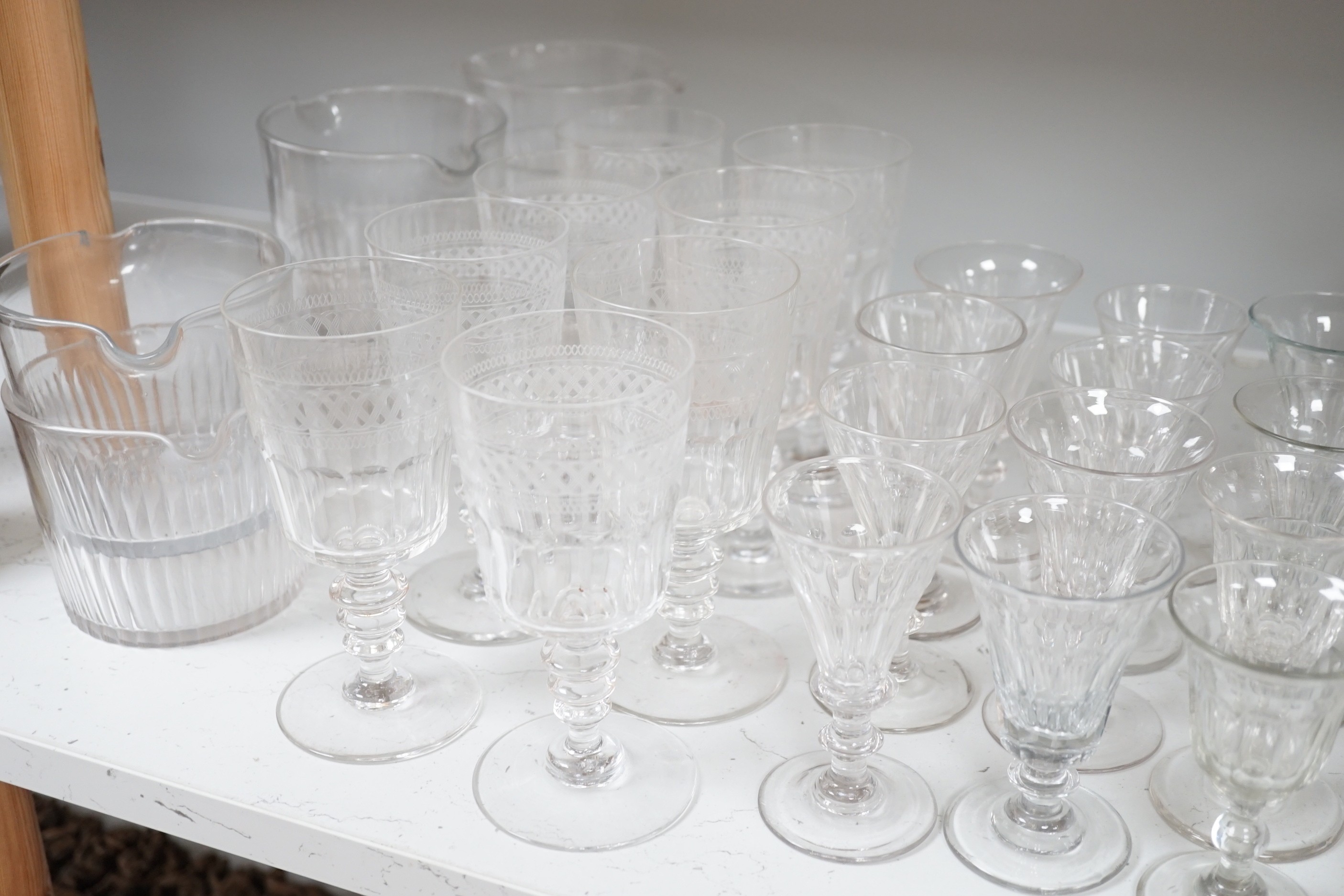 Assorted 19th and 20th century drinking glasses, rinsers, an etched vase, a pair of cut glass decanters and a late Georgian Anglo-Irish decanter and stopper